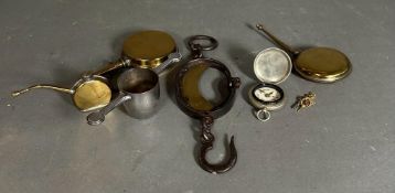 A selection of brass and white metal curios to include bottles and a compass