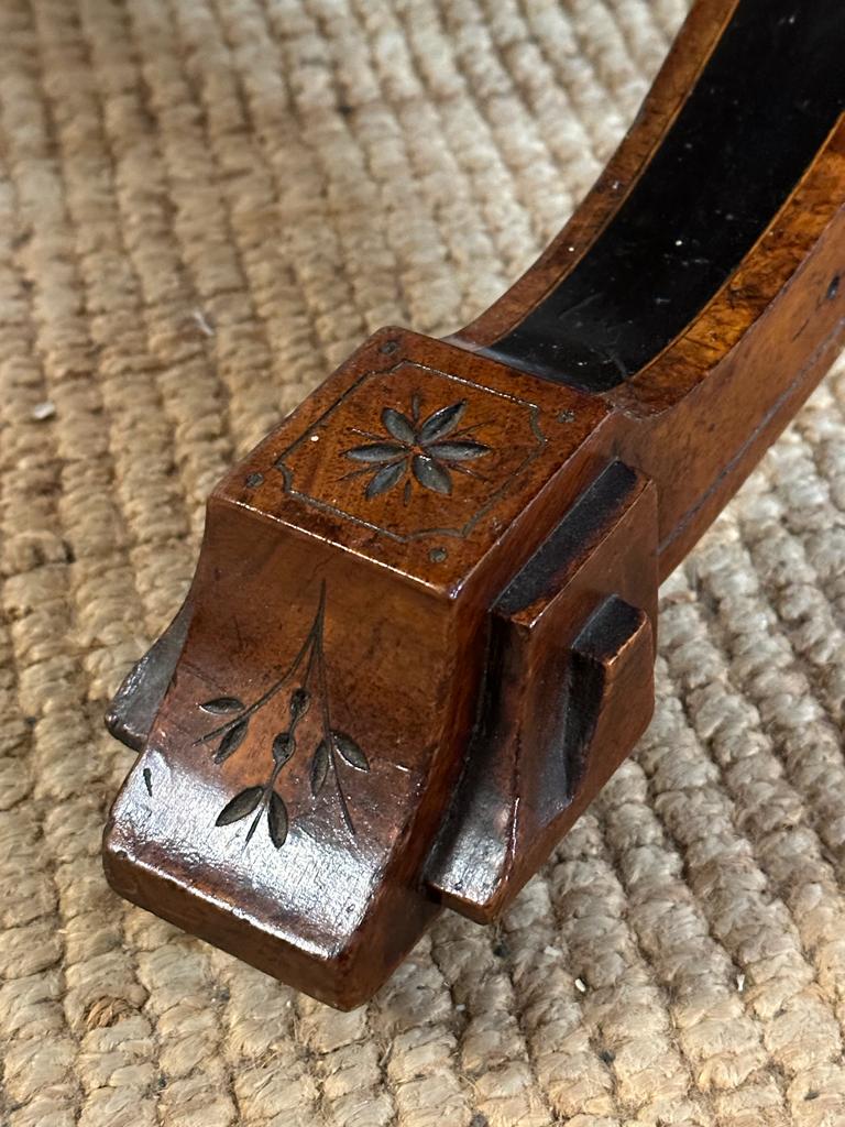 An oval walnut centre table with ebonised inlay and pierced floral detail, on four splayed legs with - Image 8 of 9