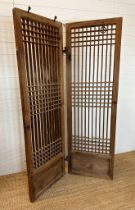 A Korean pine slatted screen 110cm x 178cm