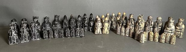 A selection of Isle of Lewis black and white chess pieces to include Kings, Queens, Bishops, Knights