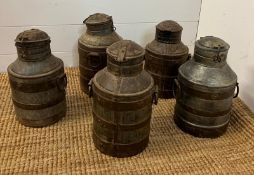 Five rustic milk churns