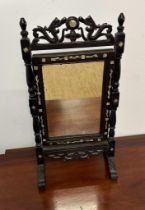 A Chinese style bathroom mirror with pierced frame and mother of pearl inlay (H45cm W24cm)