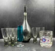 A selection of glassware to include a mid century grey smoked glass decanter and six matching