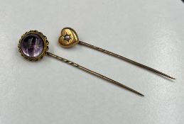 Two gold lapel pins, one engraved for 1899