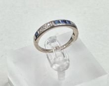 A diamond and sapphire, half eternity style ring set in 18ct white gold, approximate size M