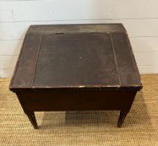 A mahogany desk top with hinged lid revealing storage and pigeon holes (H48cm W63cm D58cm)