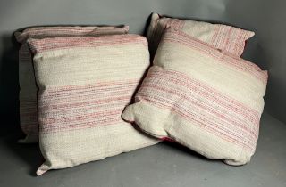 Four square throw cushions with red strips