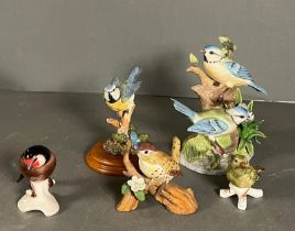 Five bird ornaments