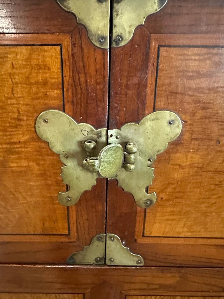 A Korean two toned cabinet comprising of two cupboards with four drawers over, brass hinges, handles - Image 2 of 6