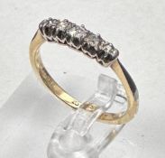 An 18ct five stone diamond ring, approximate size N
