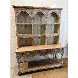 A French kitchen style painted dresser, six shelves and two drawers over and three drawers and shelf