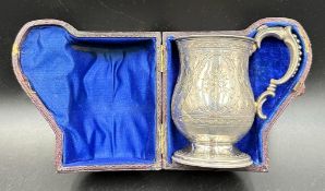 A Victorian cased Christening tankard with floral design, hallmarked for Birmingham 1875, Hilliard &