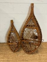 Two pairs of vintage wooden webber snow shoes