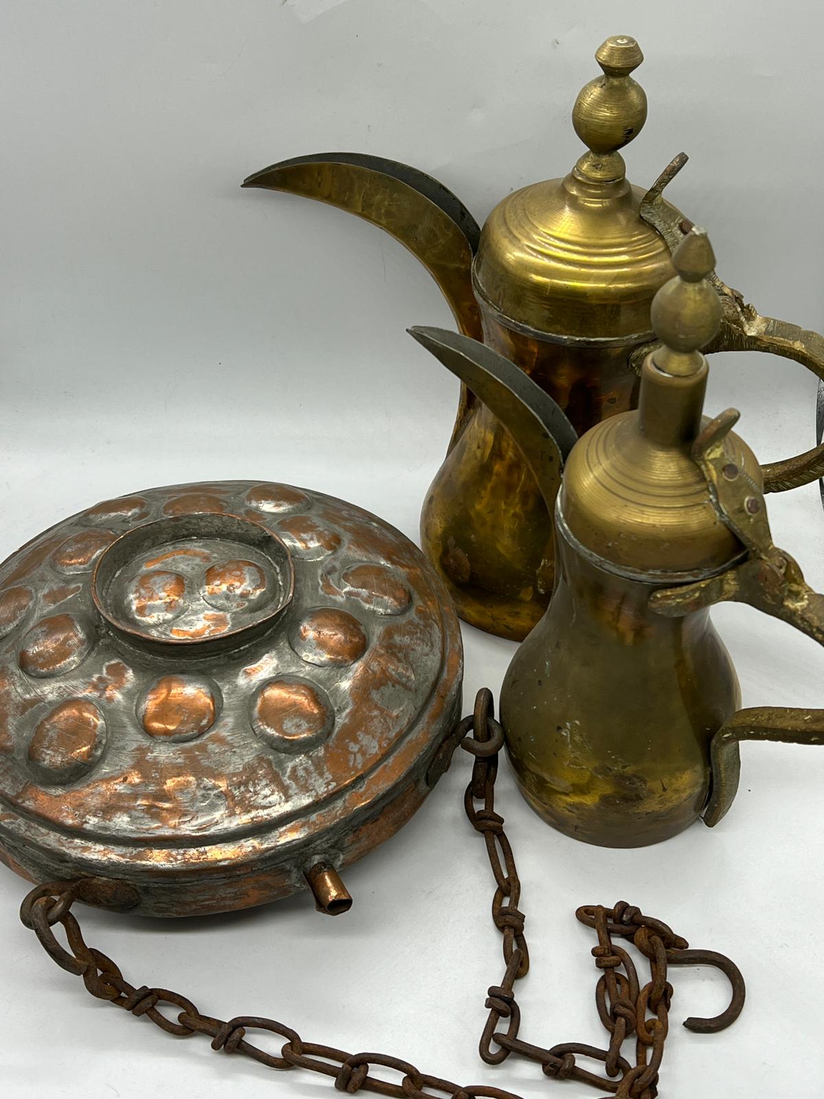Two Middles Eastern coffee pots and a copper flask/container on a chain - Image 2 of 4