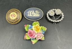 A selection of costume brooches to include a Wedgewood Jasperware brooch