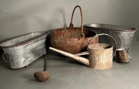 A selection of vintage metal and copper items to include planters, watering can and a cauldron