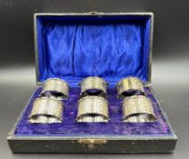 A Boxed set of six silver napkin rings, hallmarked for Birmingham by John Rose 1916