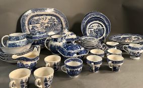 A large quantity of blue and white china to include plates, platters and serving dishes