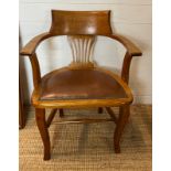 An oak desk chair Edwardian style leather seat and studded detail