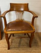 An oak desk chair Edwardian style leather seat and studded detail