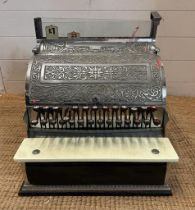 A vintage American embossed metal casted register