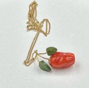 An 18ct gold fine necklace with decorative apple pendant
