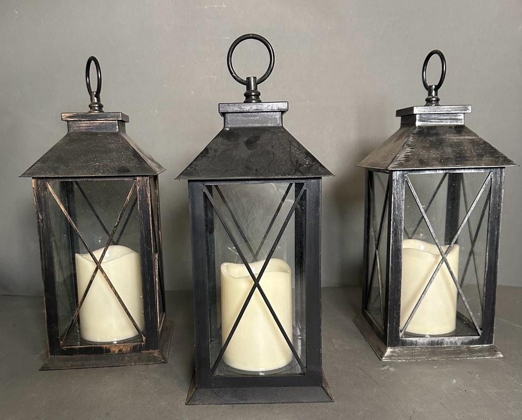 Three black glazed hanging lanterns