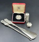 A selection of silver curios to include a silver proof £1 coin