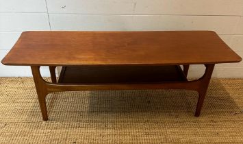 A teak Mid Century coffee table with shelf under (H40cm W116cm D40cm)