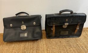Two government officers briefcases along with newspaper cuttings of Sir Winston Churchill