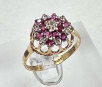 A 9ct gold diamond and garnet ring, approximate size Q