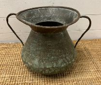 A hammered copper two handled pot (H62cm Dia 32cm)
