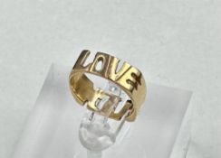 A 14ct gold ring, with Love and F*** on it, approximate total weight 3.9g and size K