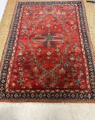 A red ground Keshan Shirvaz style rug 210cm x 148cm