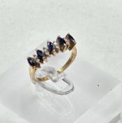 A 9ct gold sapphire and diamond ring. Size L