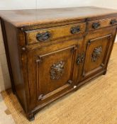 Oak sideboard with carved crest detail to front (H90cm W130cm D50cm)