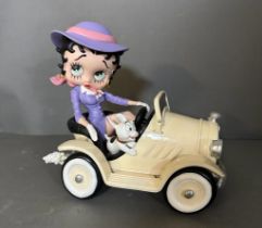 A collectable Betty Boop car and figure.