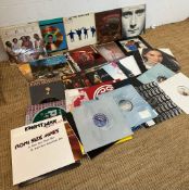 A selection of vinyl LP to include The Beatles Help, Chic and Phil Collins