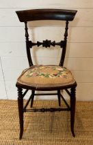 A mahogany Victorian hall chair with carved mid rail on turned down swept legs AF