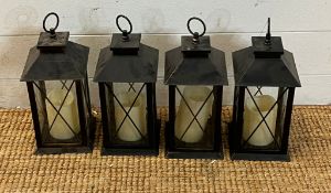 Four metal lanterns