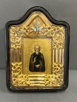 A Russian icon in a glazed case 27cm x 36cm