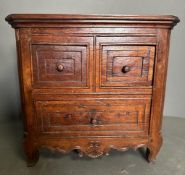 A small mahogany desk top two over one chest of drawers (H32cm W32cm D23cm)