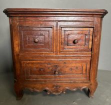 A small mahogany desk top two over one chest of drawers (H32cm W32cm D23cm)