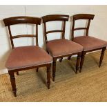 Three mahogany dining chairs on turned front legs