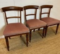 Three mahogany dining chairs on turned front legs