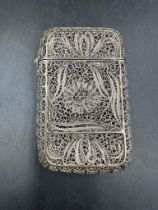 A silver filigree card case