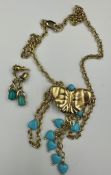 A 9ct gold and turquoise set of butterfly themed necklace and earrings. (Approximate Total Weight