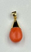 An 18ct gold mounted coral pendant, approximate total weight is 15g