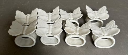 A set of eight Fitz and Floyd butterfly while porcelain napkin rings