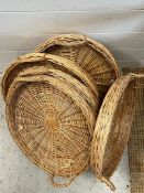 Five circular wicker tray baskets